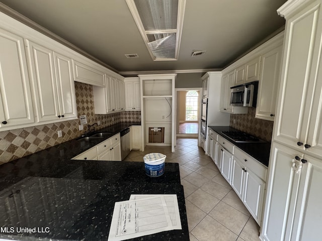 314 Fox Holw, Canton, MS 39046 - kitchen with appliances with stainless steel finishes, a sink, dark countertops, light tile patterned floors, and decorative backsplash