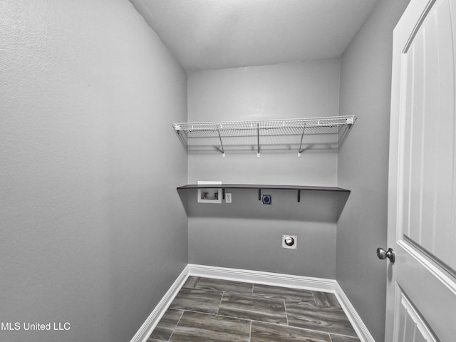 laundry room with washer hookup, electric dryer hookup, baseboards, and laundry area