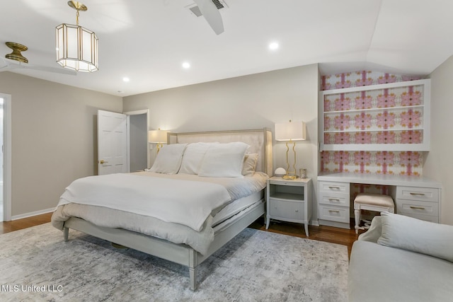 bedroom with vaulted ceiling, baseboards, wood finished floors, and recessed lighting