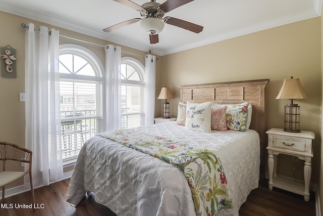 bedroom featuring baseboards, a ceiling fan, wood finished floors, and ornamental molding