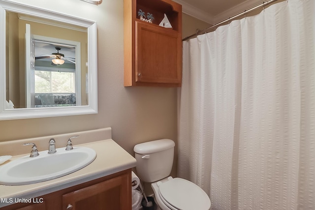 full bathroom featuring ceiling fan, toilet, ornamental molding, and vanity