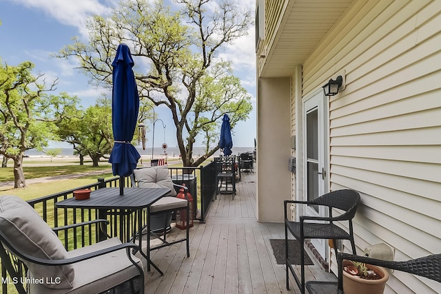 deck with outdoor dining space