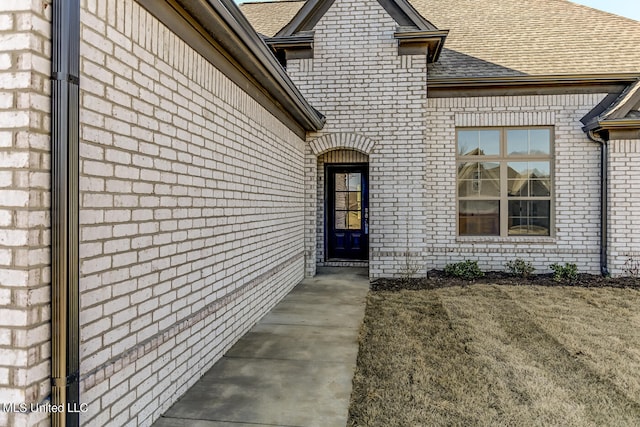 entrance to property with a yard