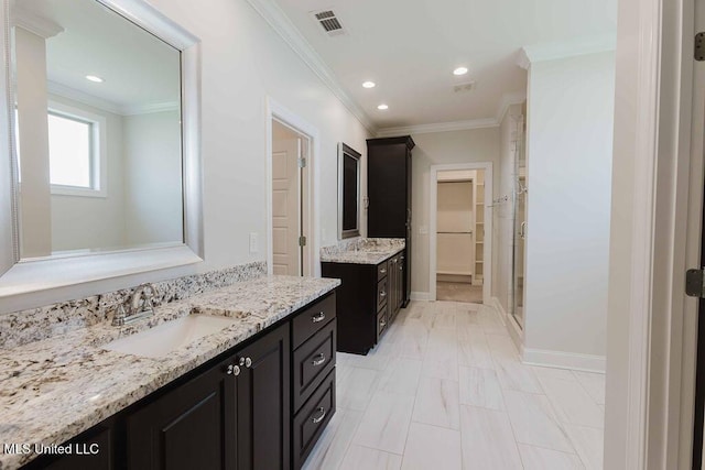 132 Freeland Ln, Clinton, MS 39056 - full bathroom featuring crown molding, two vanities, a stall shower, recessed lighting, and a spacious closet