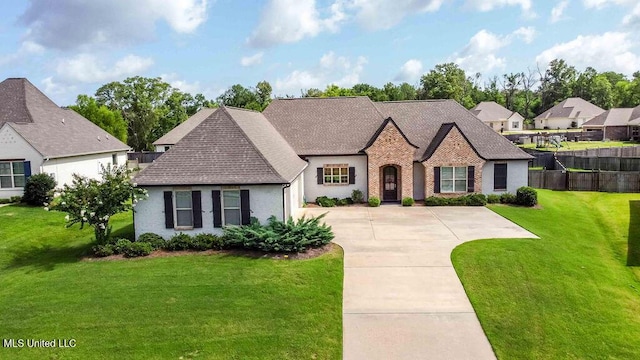132 Freeland Ln, Clinton, MS 39056 - french country home featuring roof with shingles and concrete driveway