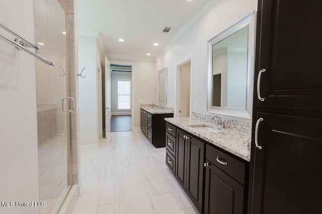 132 Freeland Ln, Clinton, MS 39056 - bathroom featuring ornamental molding, a stall shower, and two vanities