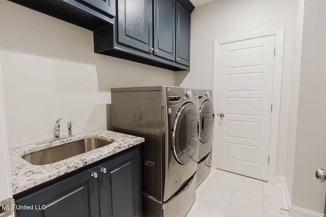 132 Freeland Ln, Clinton, MS 39056 - washroom featuring cabinet space, separate washer and dryer, and light tile patterned floors