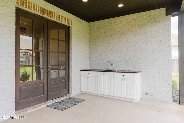 132 Freeland Ln, Clinton, MS 39056 - doorway to property featuring french doors and stucco siding