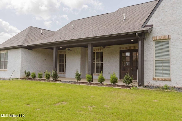 132 Freeland Ln, Clinton, MS 39056 - rear view of property featuring ceiling fan, a lawn, brick siding, and a patio area