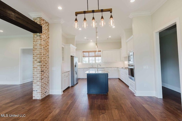 132 Freeland Ln, Clinton, MS 39056 - kitchen featuring stainless steel appliances, a center island with sink, white cabinetry, backsplash, and dark wood-type flooring
