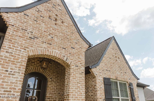 132 Freeland Ln, Clinton, MS 39056 - view of side of home featuring brick siding and roof with shingles