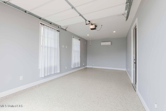 132 Freeland Ln, Clinton, MS 39056 - empty room with speckled floor, a wall mounted AC, and recessed lighting