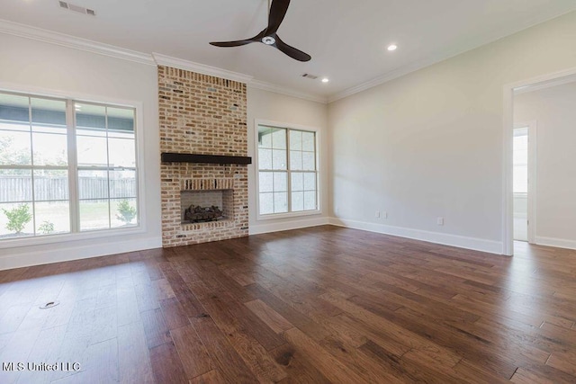 132 Freeland Ln, Clinton, MS 39056 - unfurnished living room featuring ceiling fan, dark wood-type flooring, crown molding, a brick fireplace, and recessed lighting