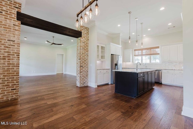 132 Freeland Ln, Clinton, MS 39056 - kitchen featuring stainless steel appliances, ornamental molding, white cabinets, decorative backsplash, and dark wood-type flooring