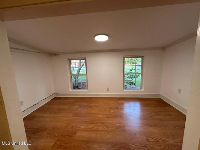 153 Saint Peter St, Biloxi, MS 39530 - spare room featuring plenty of natural light, wood finished floors, and baseboards