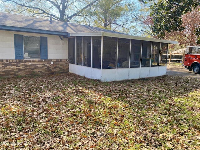 view of home's exterior featuring a sunroom