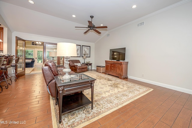 living room with crown molding, ceiling fan, lofted ceiling, light wood-style floors, and baseboards