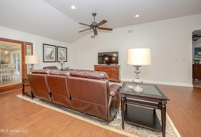 living area with a ceiling fan, light wood-style flooring, crown molding, lofted ceiling, and baseboards