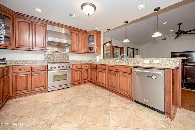 kitchen featuring stainless steel appliances, wall chimney exhaust hood, a sink, a peninsula, and ceiling fan