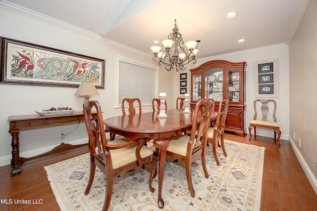 dining area with a chandelier, wood finished floors, baseboards, recessed lighting, and crown molding