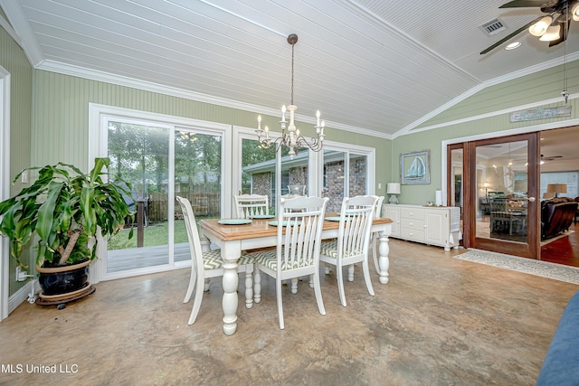 dining space with vaulted ceiling, ceiling fan, a chandelier, and crown molding