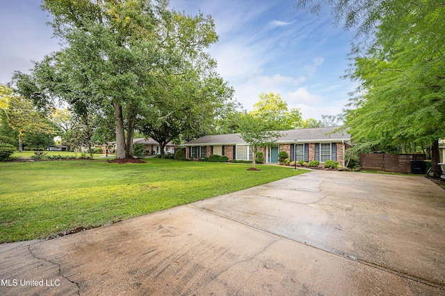 ranch-style house with concrete driveway and brick siding