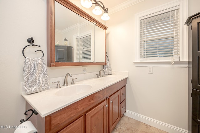 bathroom featuring crown molding, baseboards, and double vanity