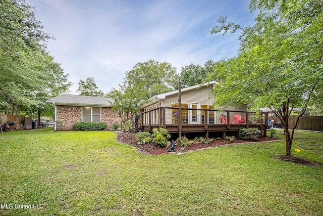 back of house with a deck and brick siding