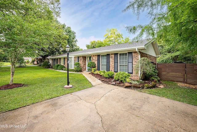 ranch-style house with brick siding and roof with shingles