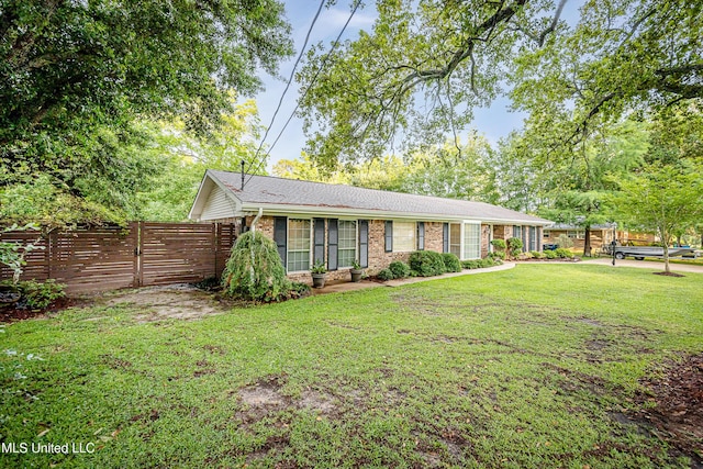 single story home featuring brick siding
