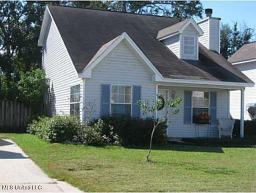 cape cod-style house with a front lawn