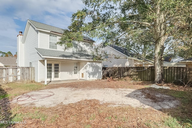 back of house featuring a patio area and french doors