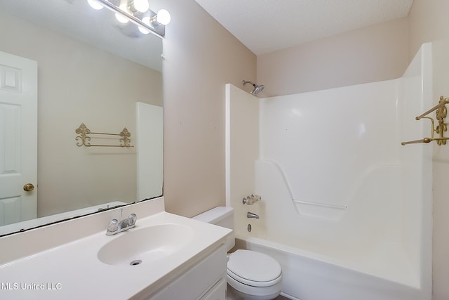 full bathroom featuring vanity, a textured ceiling, shower / bath combination, and toilet