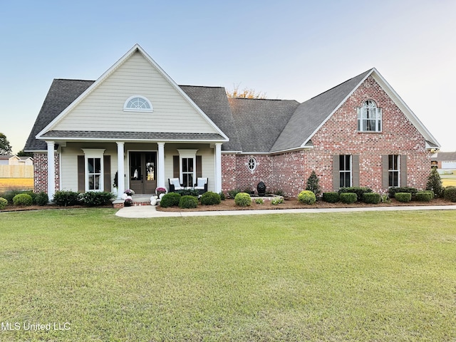 view of front of home featuring a front lawn and a porch