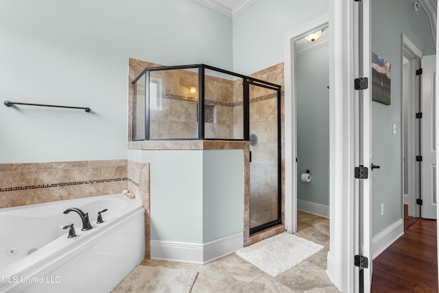 3841 Chateau Cv, Ocean Springs, MS 39564 - bathroom featuring a stall shower, a whirlpool tub, and ornamental molding