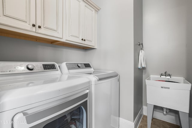 3841 Chateau Cv, Ocean Springs, MS 39564 - laundry area featuring independent washer and dryer and cabinet space