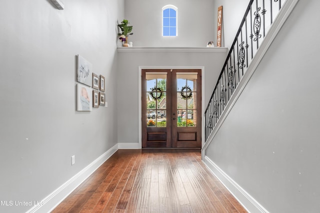 3841 Chateau Cv, Ocean Springs, MS 39564 - foyer entrance with french doors, healthy amount of natural light, hardwood / wood-style floors, stairs, and a towering ceiling