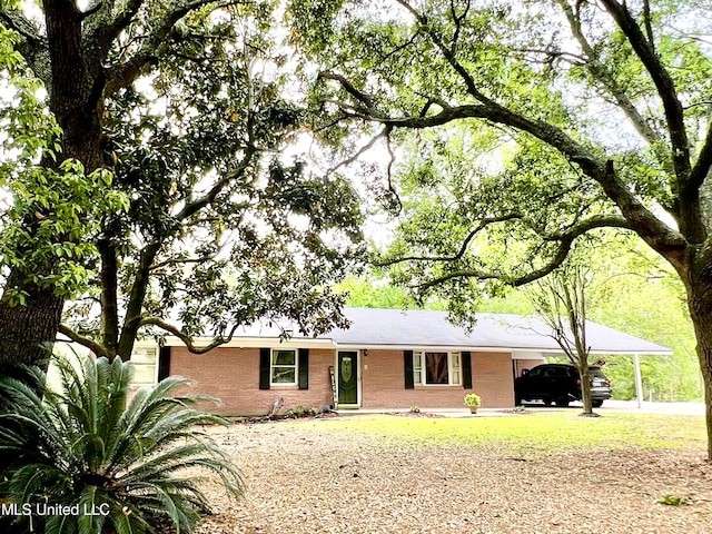 ranch-style house with a carport