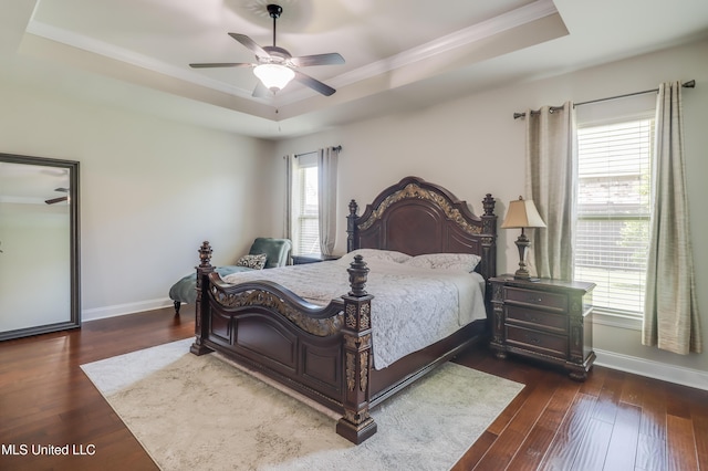 3936 David Ln, Diberville, MS 39540 - bedroom featuring a tray ceiling, baseboards, wood-type flooring, crown molding, and ceiling fan