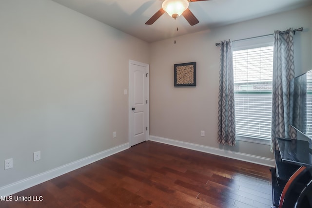 3936 David Ln, Diberville, MS 39540 - spare room featuring a ceiling fan, wood finished floors, and baseboards