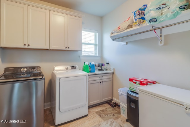 3936 David Ln, Diberville, MS 39540 - clothes washing area with washing machine and clothes dryer, cabinet space, and baseboards