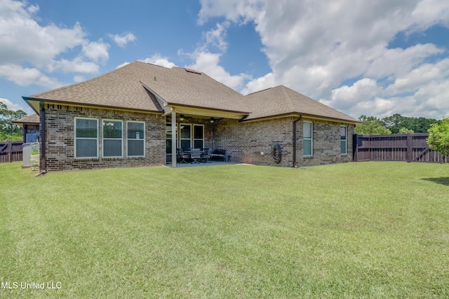 3936 David Ln, Diberville, MS 39540 - back of property with brick siding, roof with shingles, a patio area, and a ceiling fan