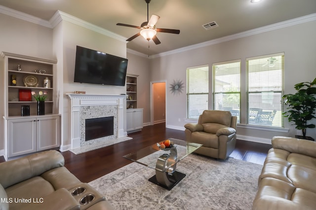 3936 David Ln, Diberville, MS 39540 - living room featuring dark wood-style flooring, ceiling fan, plenty of natural light, ornamental molding, and baseboards