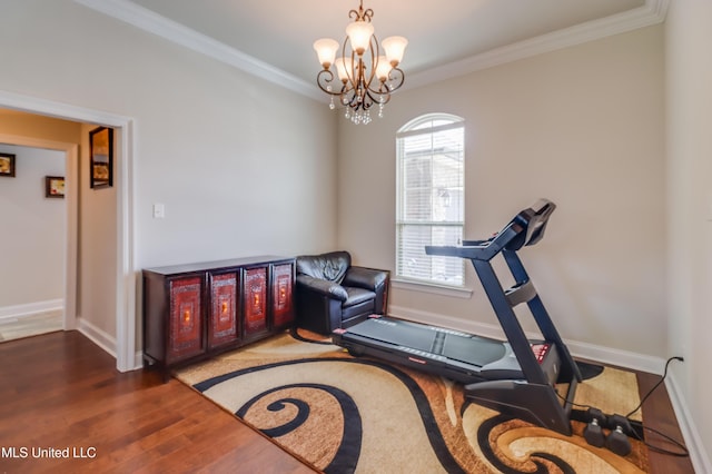 3936 David Ln, Diberville, MS 39540 - workout room with a chandelier, baseboards, ornamental molding, and wood finished floors