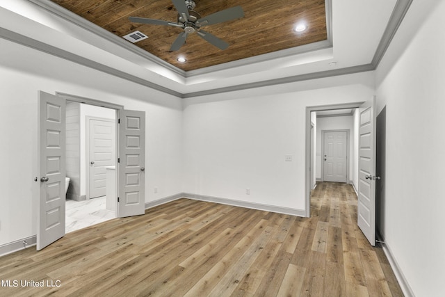 unfurnished bedroom featuring light hardwood / wood-style floors, crown molding, wooden ceiling, and a raised ceiling