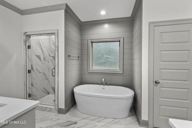 bathroom featuring vanity, ornamental molding, and independent shower and bath