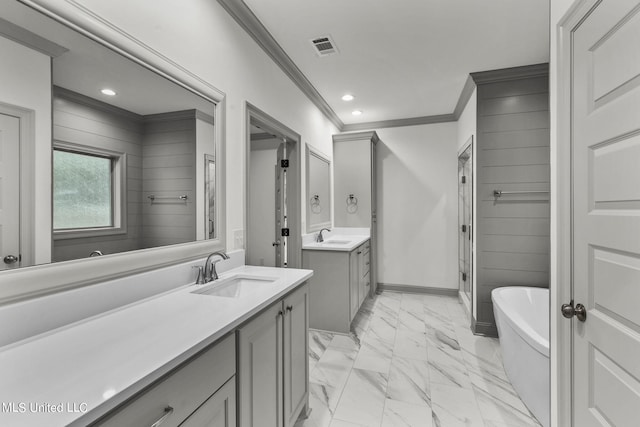 bathroom with vanity, ornamental molding, and independent shower and bath