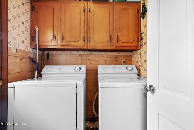 530 Oakhurst Dr, Hernando, MS 38632 - laundry room with wallpapered walls, separate washer and dryer, cabinet space, and wood walls