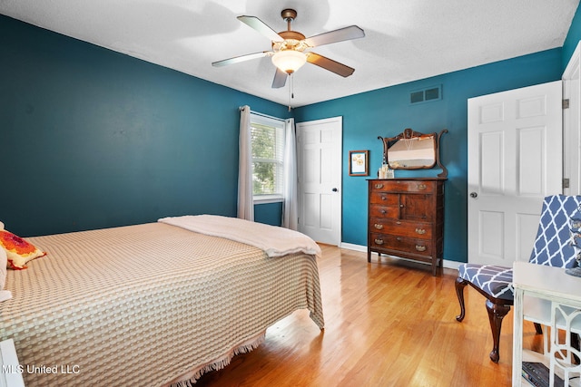 530 Oakhurst Dr, Hernando, MS 38632 - bedroom with light wood finished floors, a closet, and ceiling fan