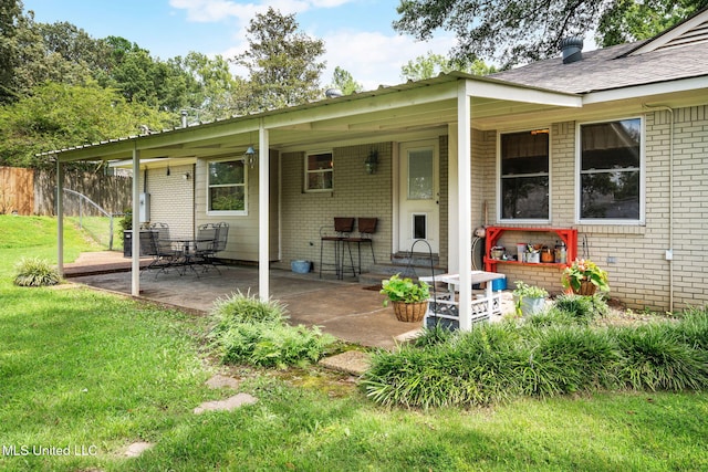 530 Oakhurst Dr, Hernando, MS 38632 - view of exterior entry featuring brick siding and a patio area